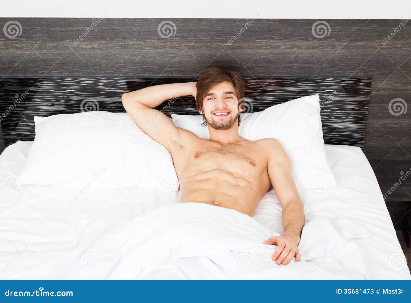 Man on bed stock image. Image of apartment, male, body 35681473