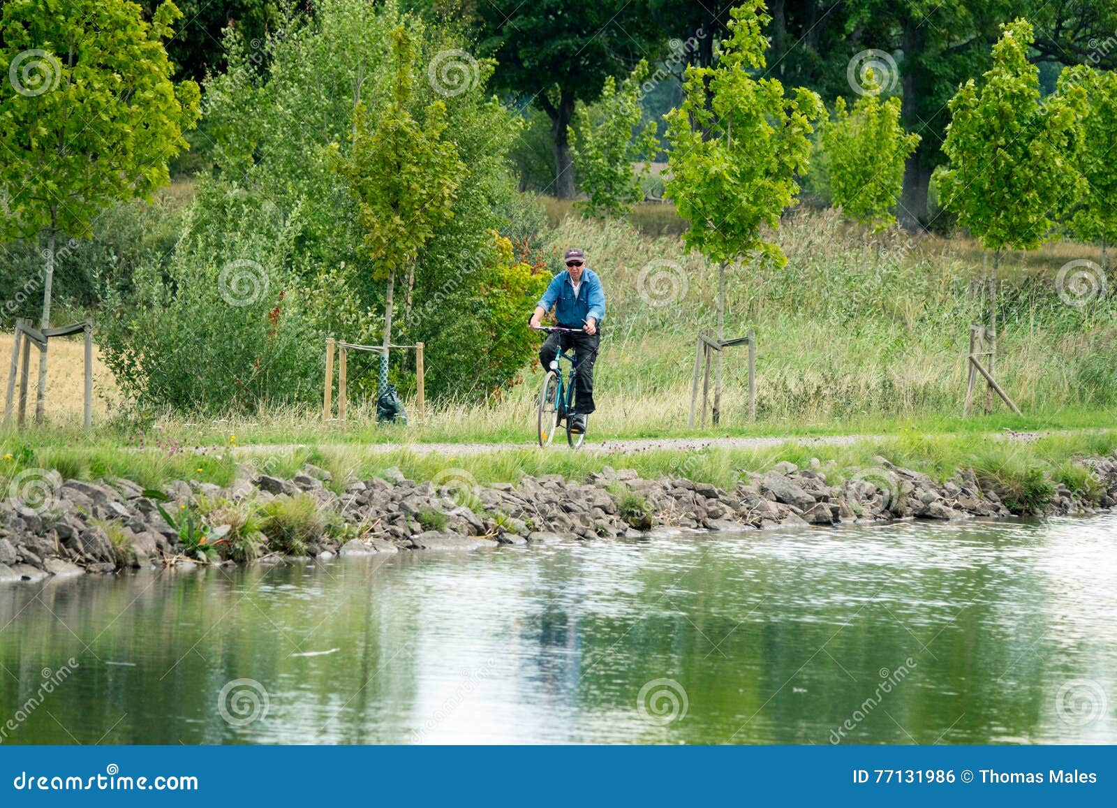 man on bicycle, gota canal, sweden