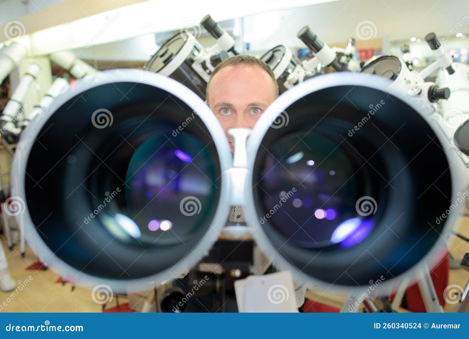 Man with binocular lenses stock photo. Image of store 260340524