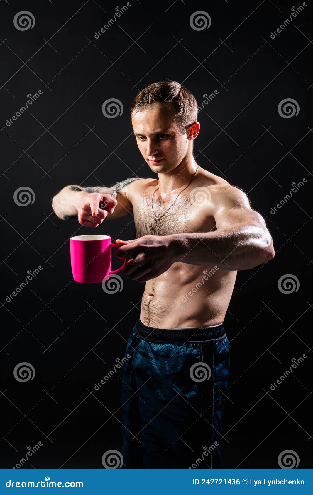 man on black background keeps dumbbells pumped up in fitness sport, body training strong bodybuilder dumbbell