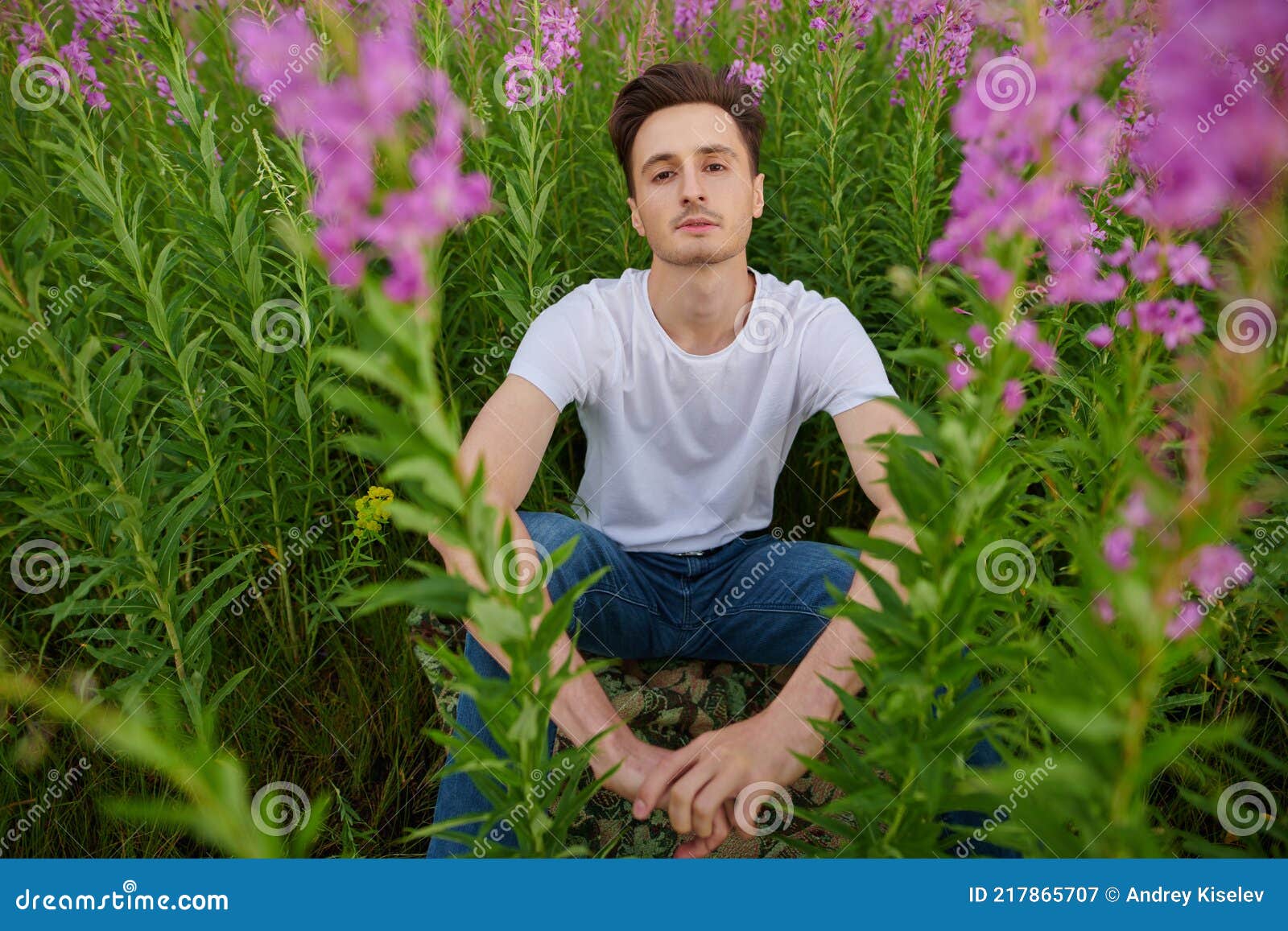 man in a blooming ivan tea