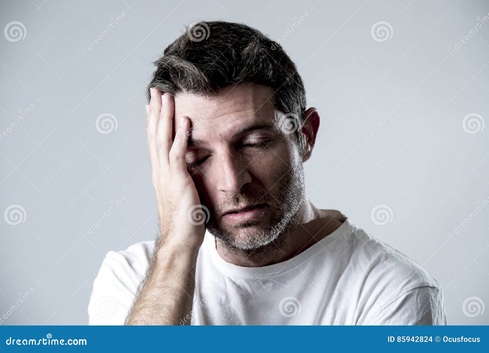man with blue eyes sad and depressed looking lonely and suffering depression feeling sorrow