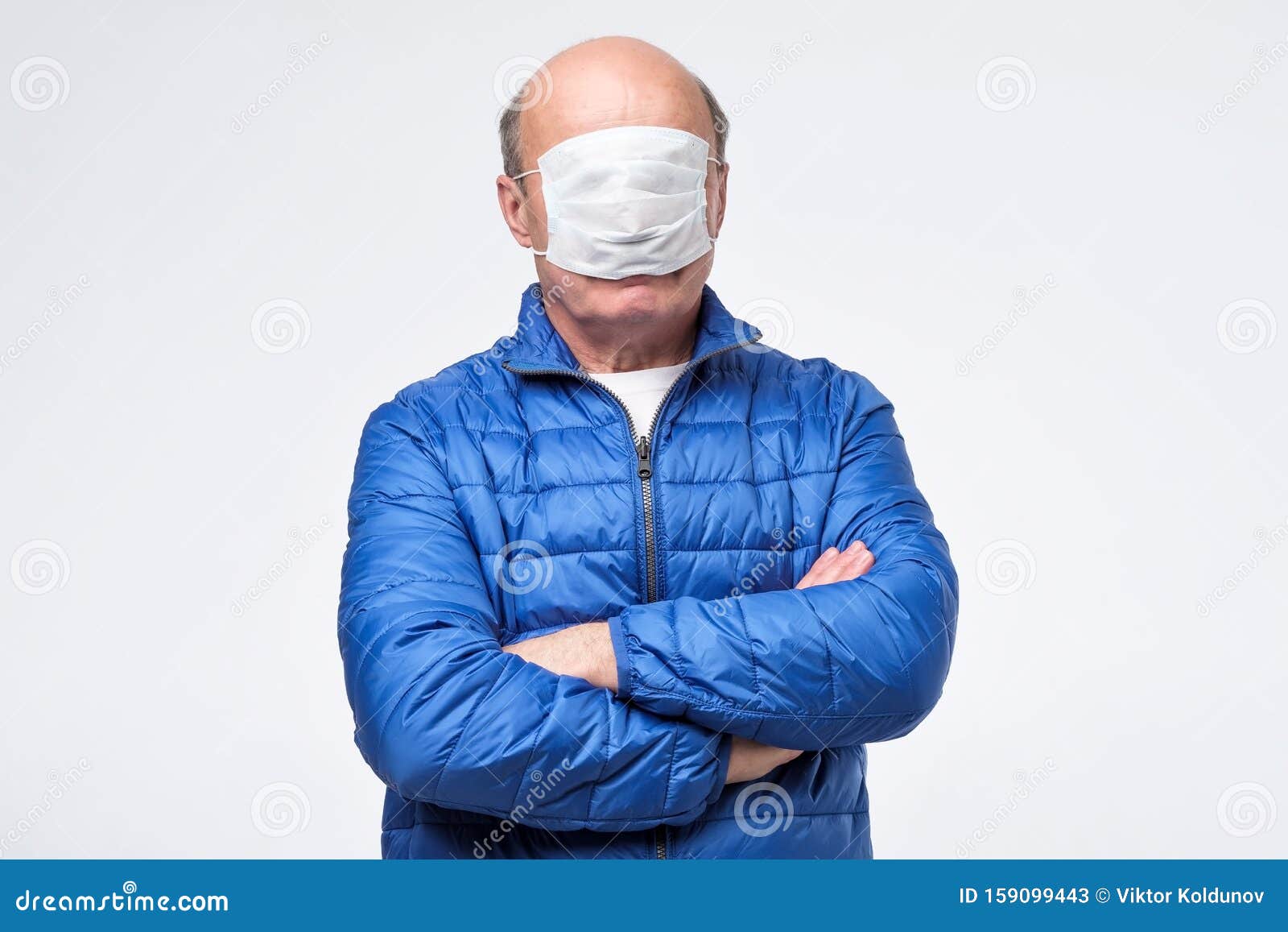 man-blue-jacket-wearing-medical-mask-wrong-way-senior-159099443.jpg