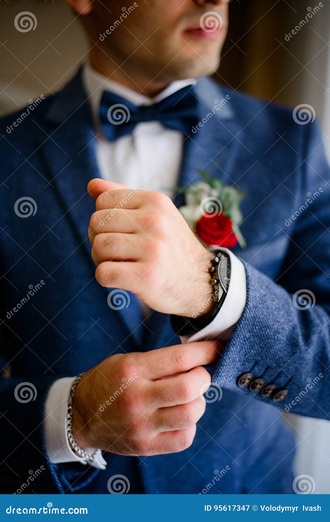Man in Blue Suit Adjusts White Sleeve Over Watch Stock Image Image of