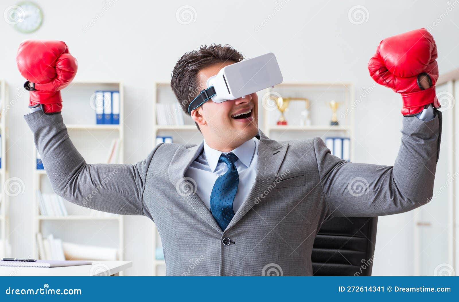 Man Boxing in the Office with Virtual Reality Goggles Stock Image