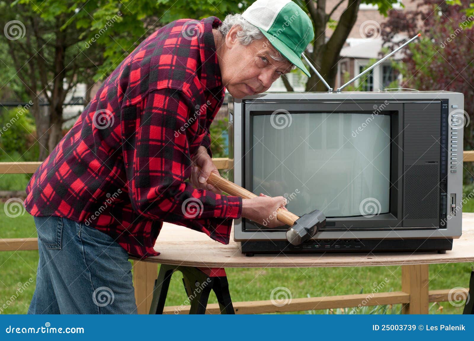 Man breaking up television stock image. Image of ears 25003739