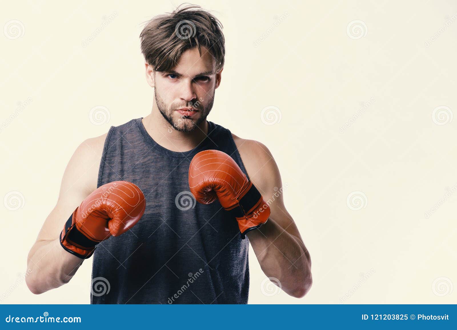 Man with Bristle and Confident Face Wears Boxing Gloves image