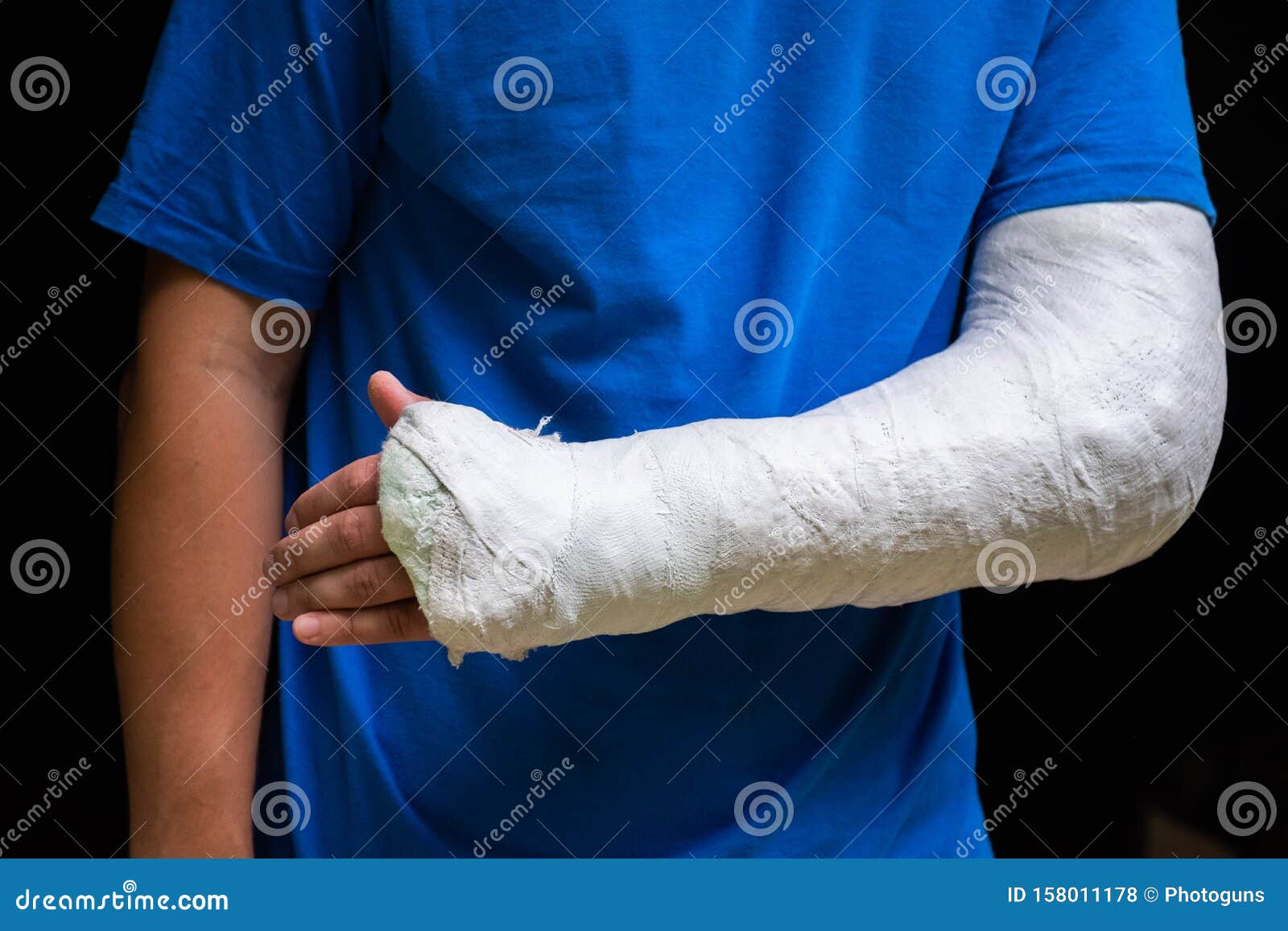 Medical plaster cotton wool scissors and bandage isolated on a blue