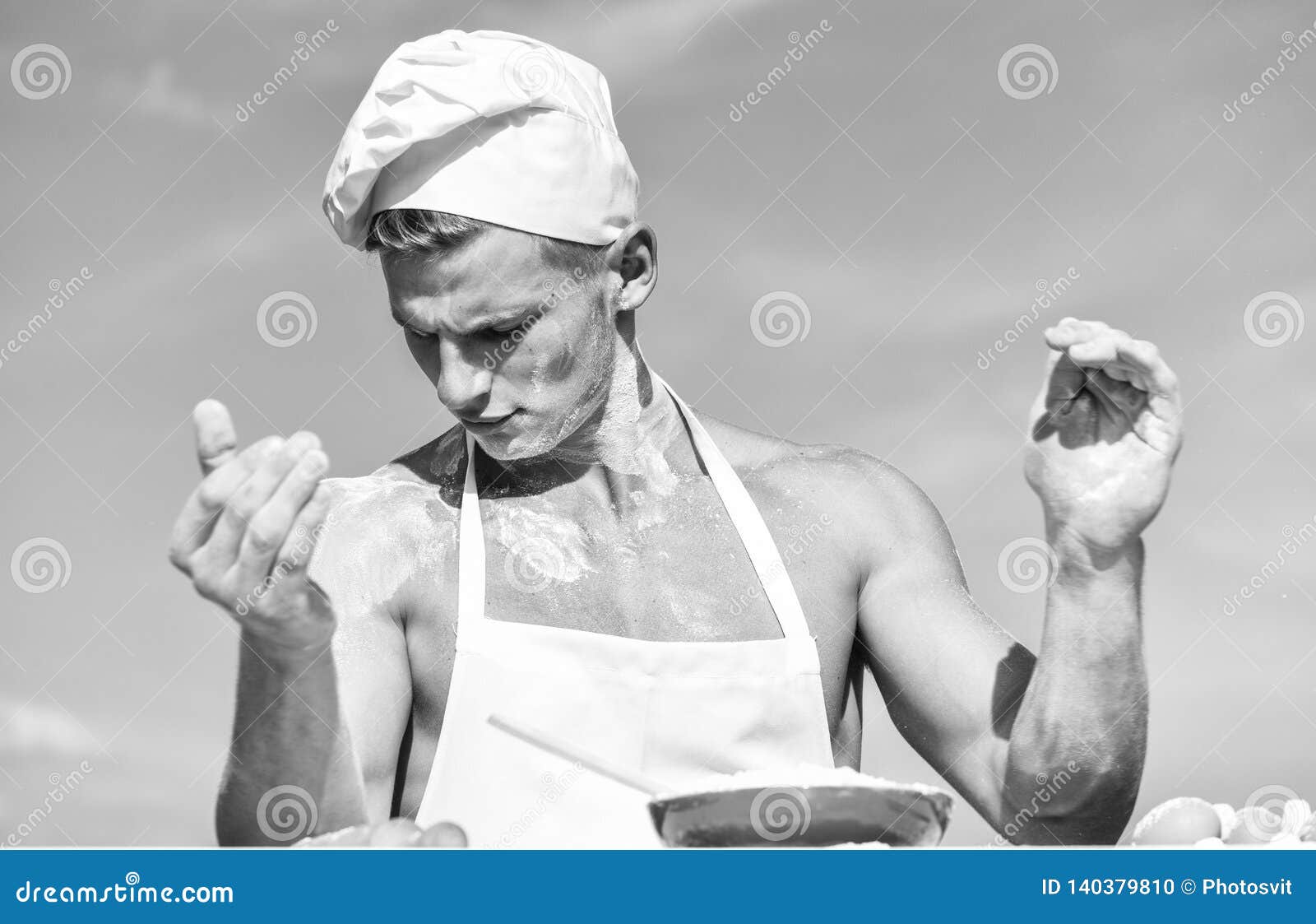Man On Busy Face Wears Cooking Hat And Apron Sky On Background Cook Or Chef With Muscular 