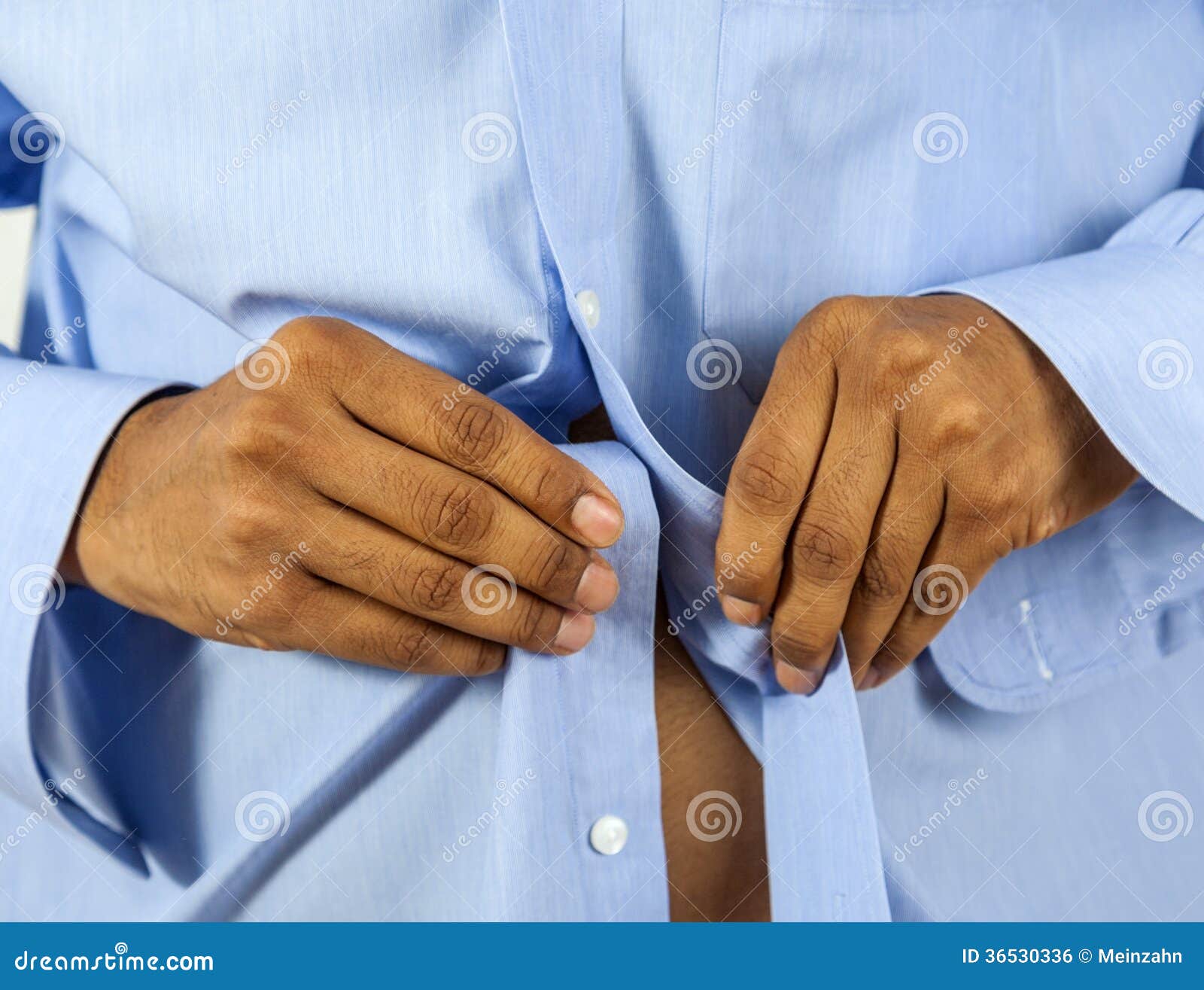 Man buttoning his shirt stock photo. Image of nervous - 36530336