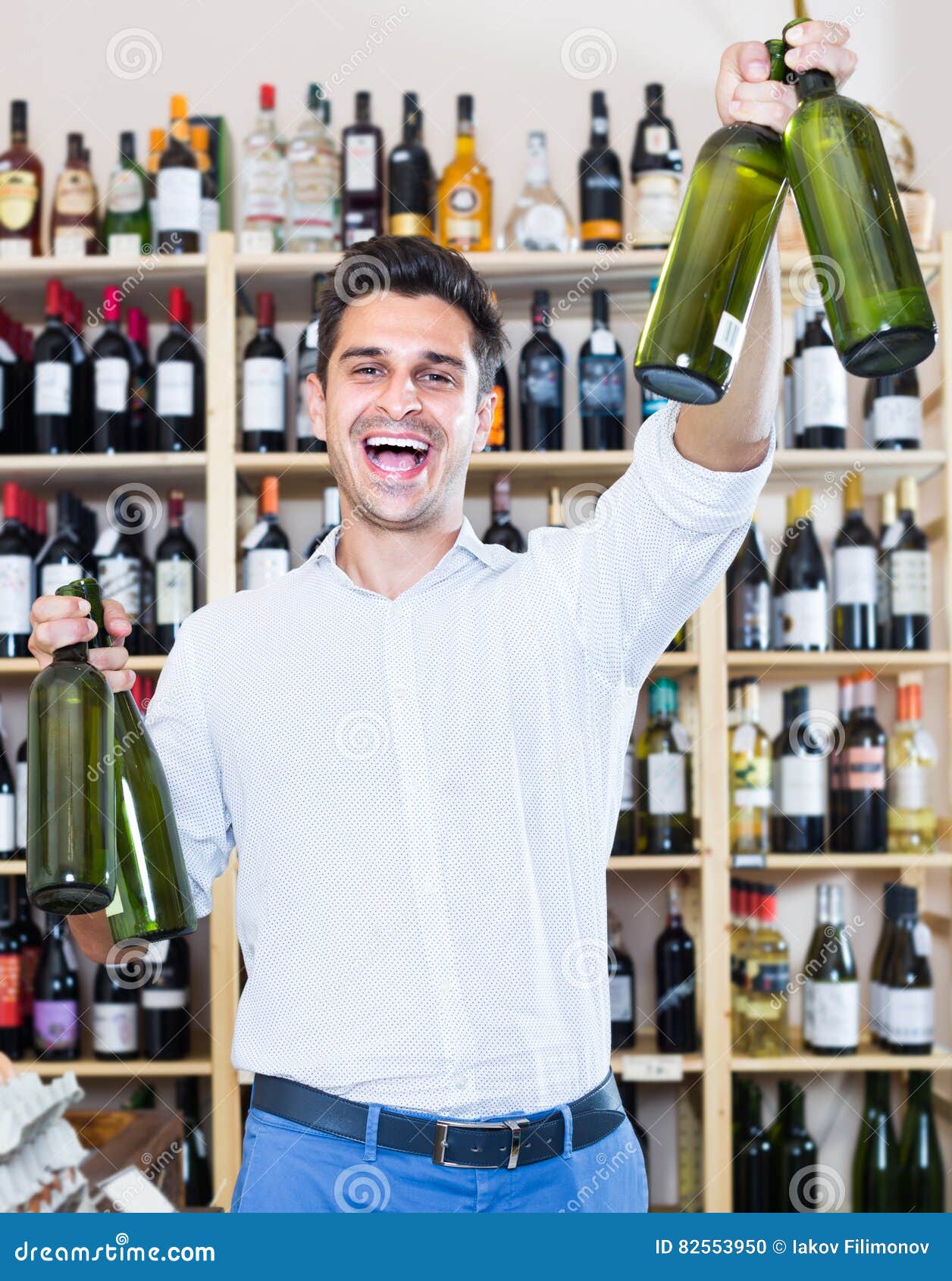 Man buying bottle of wine stock photo. Image of enjoying 82553950