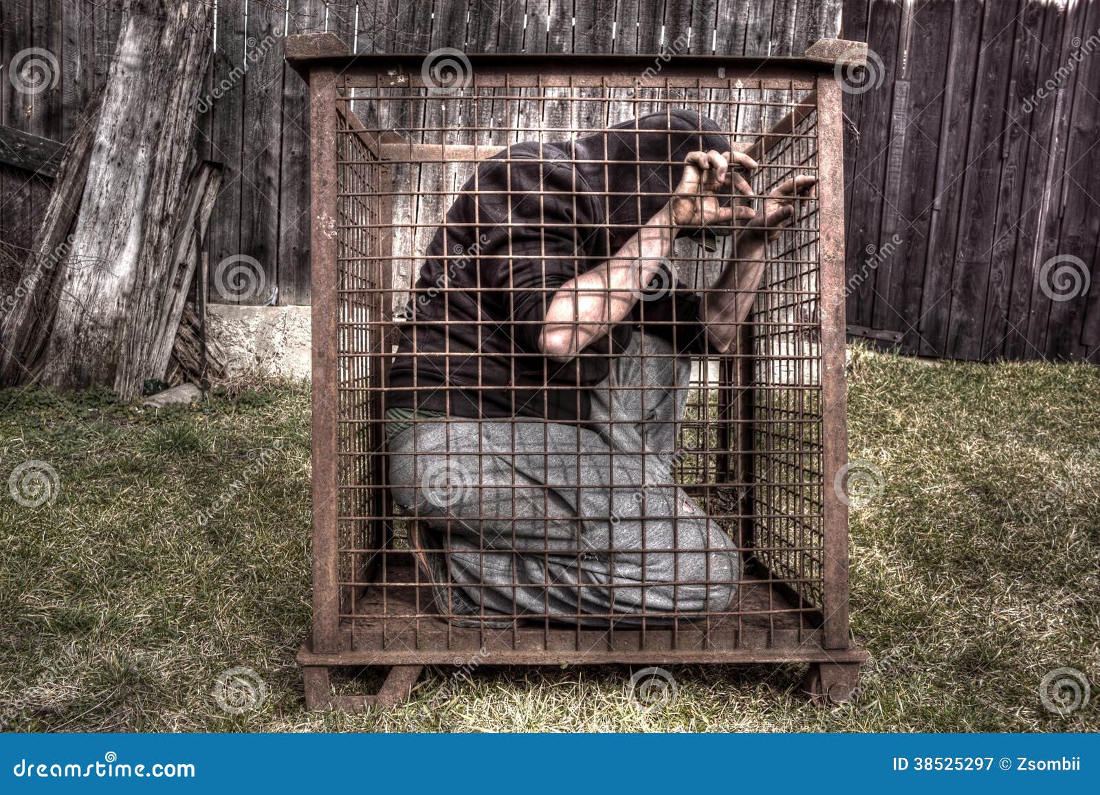 man in cage stock