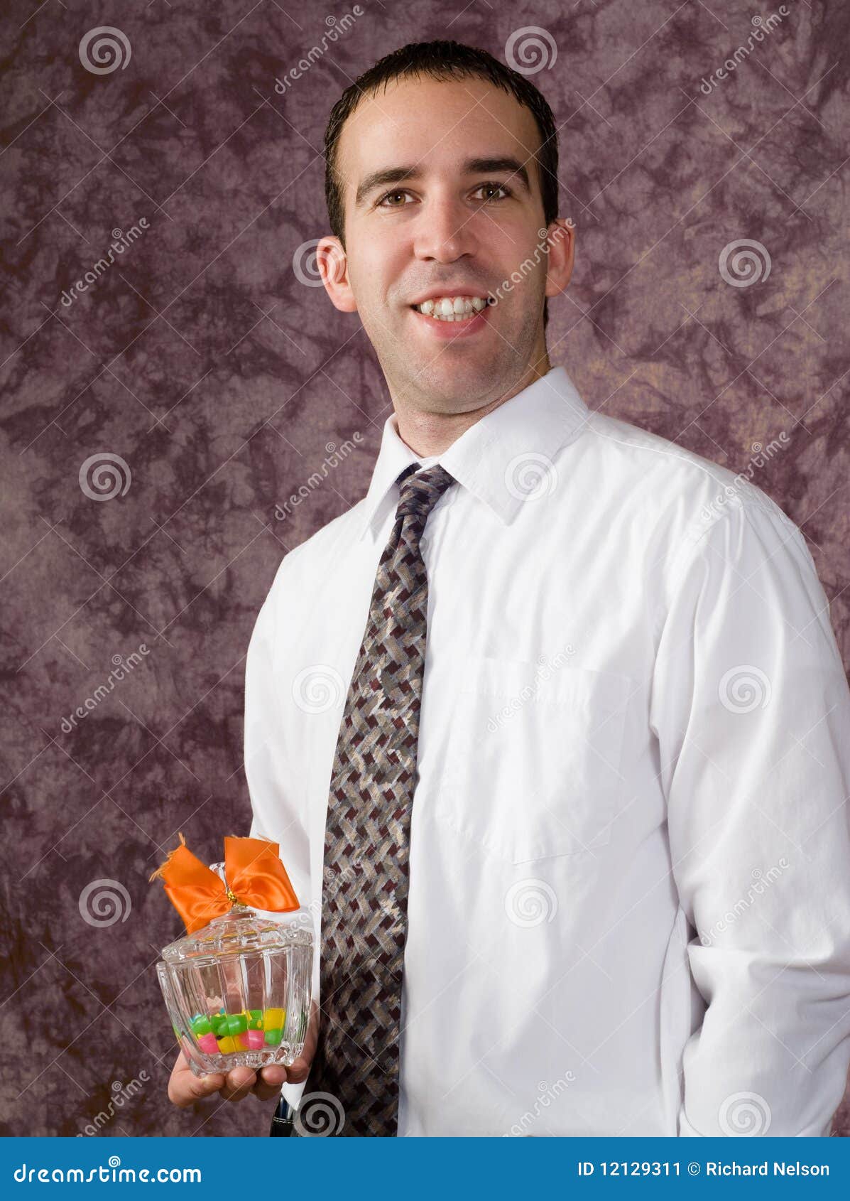 Man with candy dish stock image. Image of caucasian, background 12129311