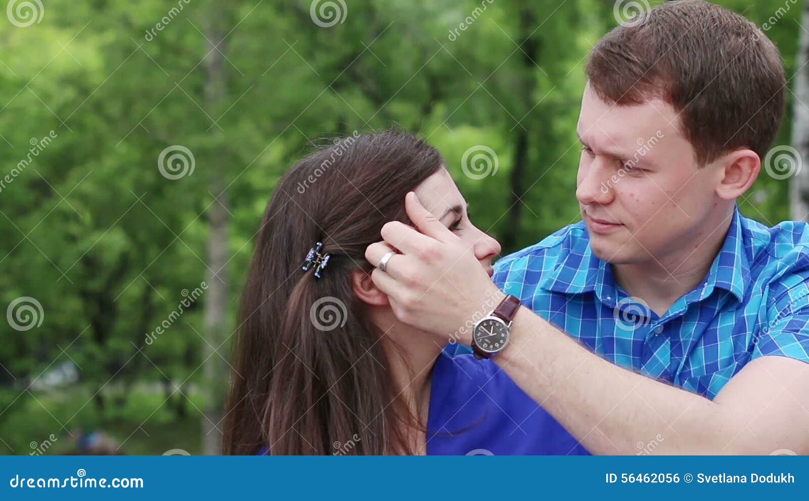 Man Caresses Woman and Strokes Her Hair