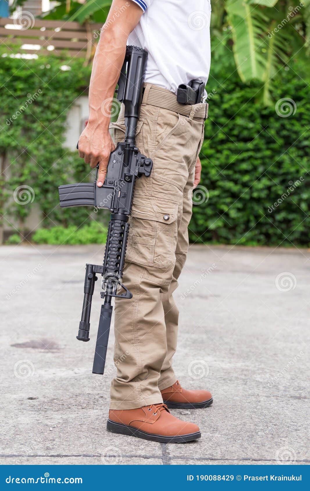 Man in Cargo Pants with Gun Stock Image Image of brown, murder 190088429