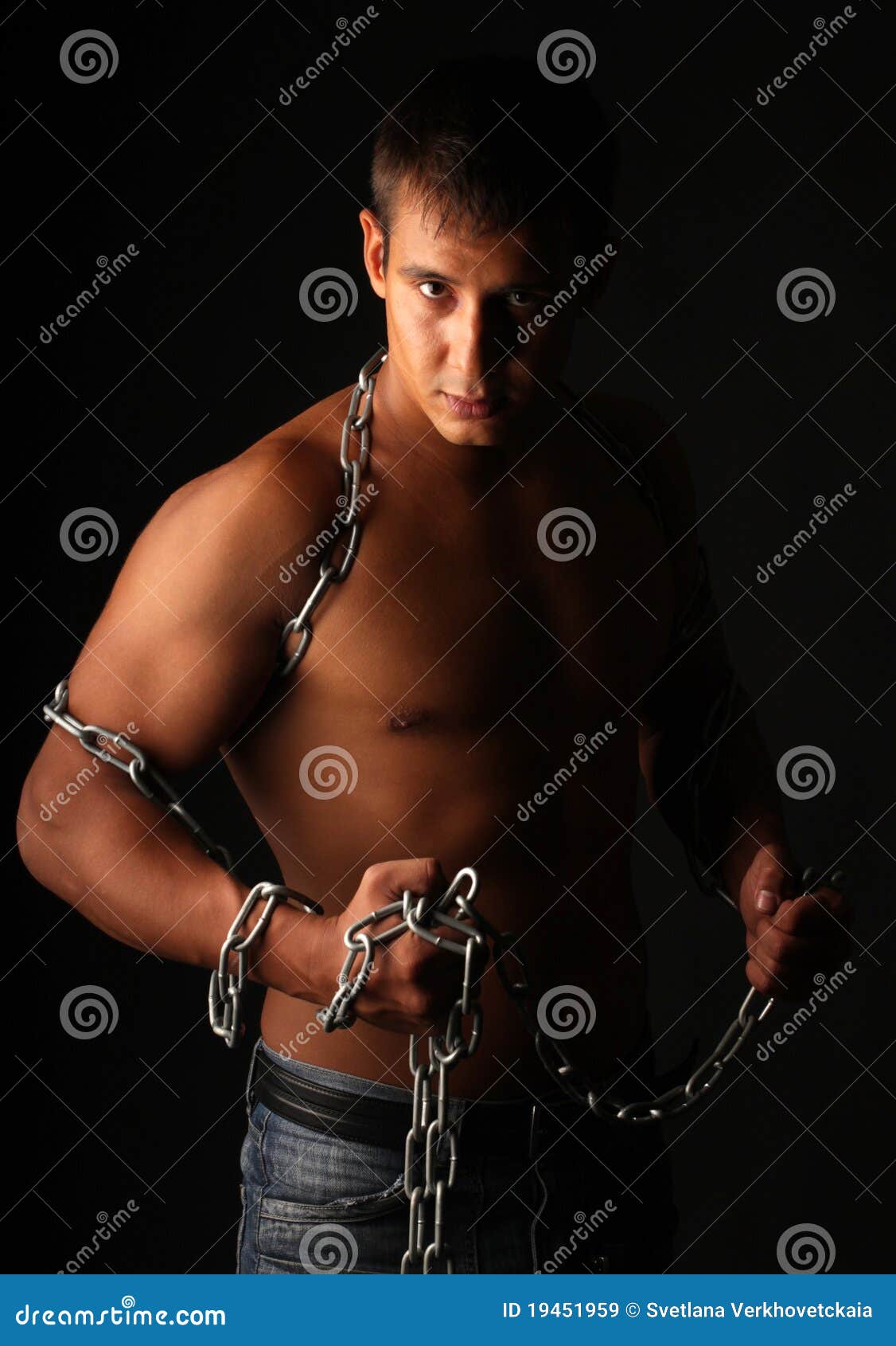 A man and a chain. stock image. Image of freedom, muscular 19451959