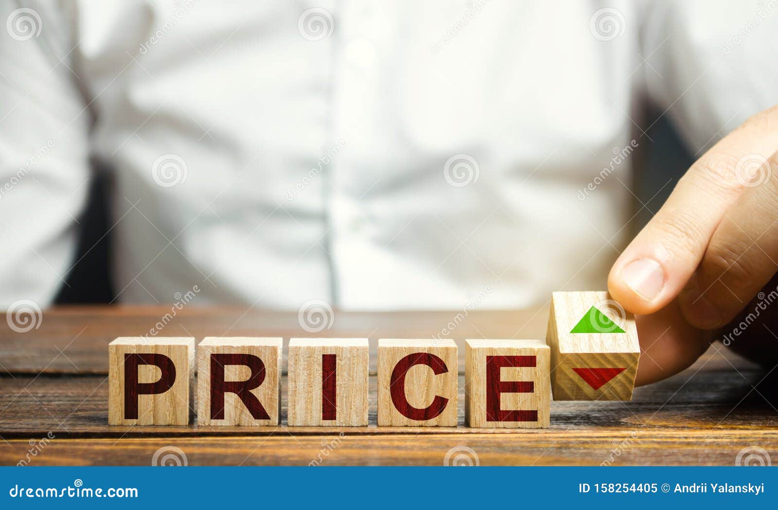 a man changes the position of a block with s of growth and decline near the word price. price regulator, supply-demand