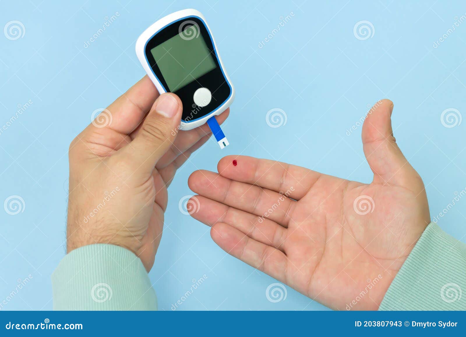 Man Checking Blood Sugar Level with Diagnostic and