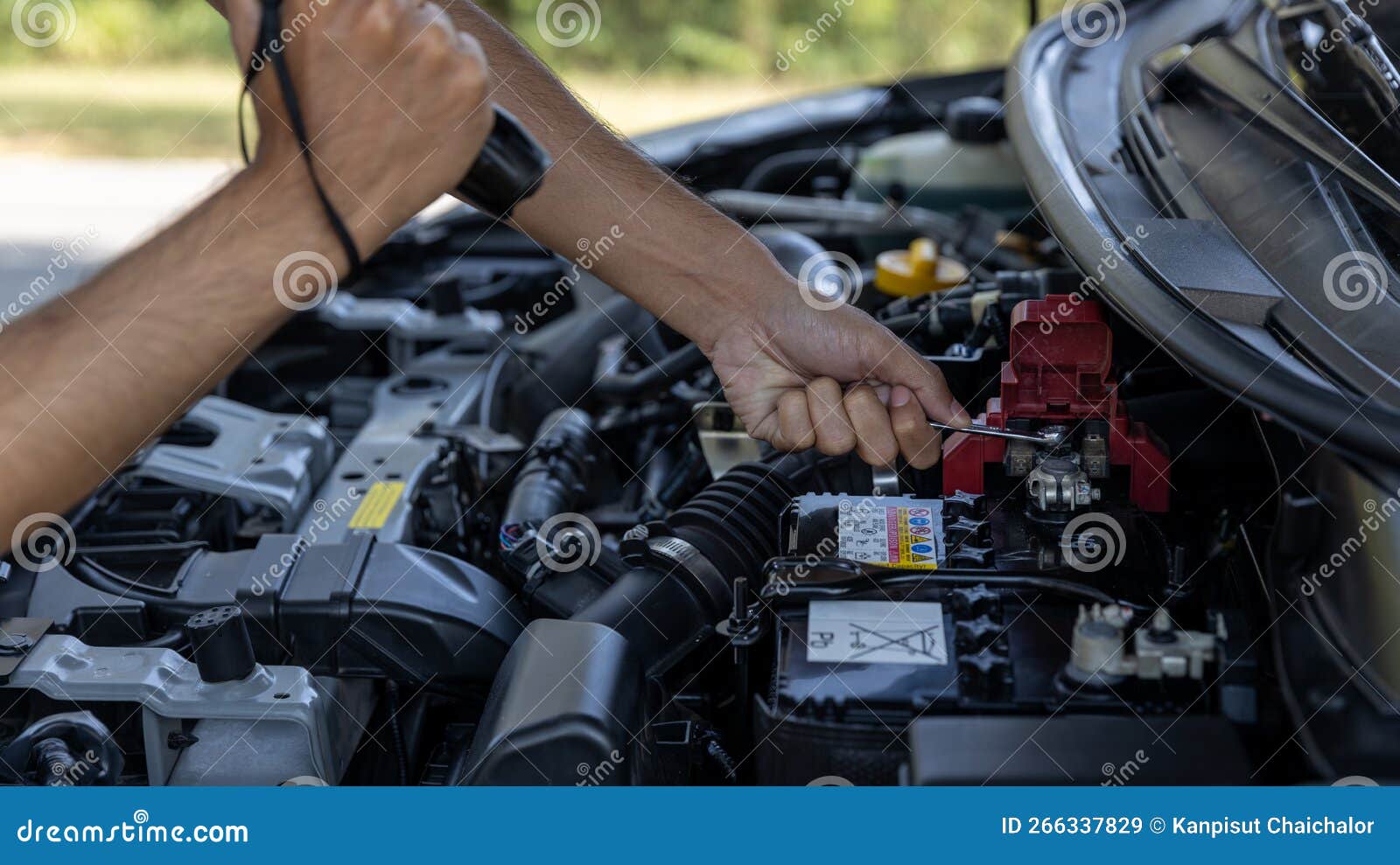 Man is Checking Car Battery because Car Battery is Depleted. Concept