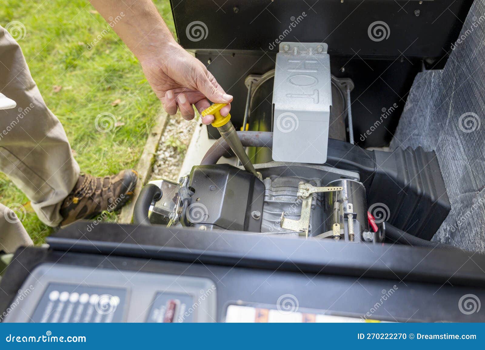 Man Checking Engine Oil in Generator, Measuring Oil Level. Maintenance