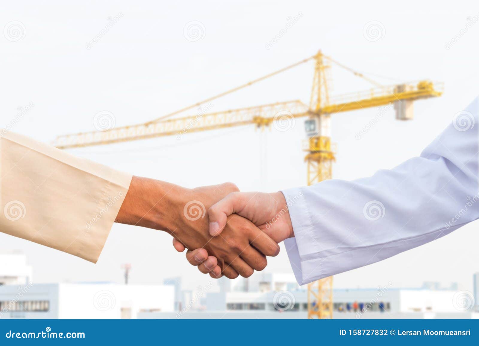 the man checking the hand with commitment to sucess at construction site and crane background