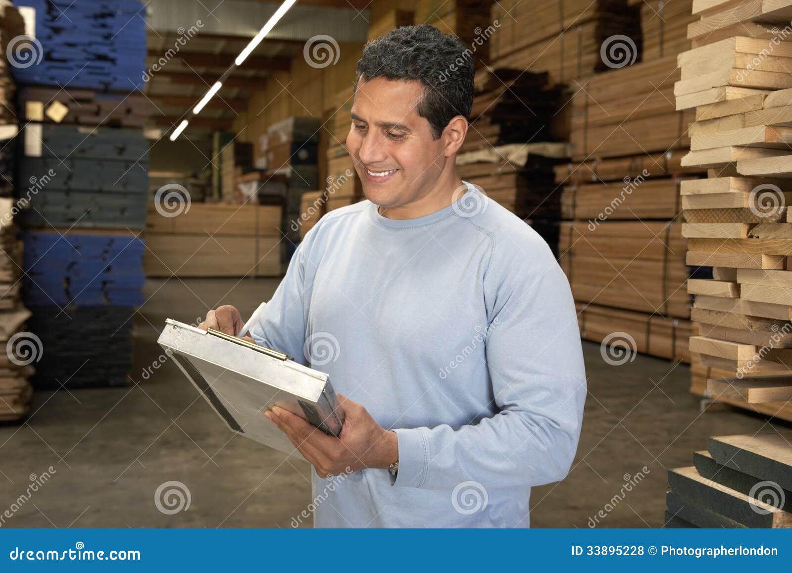 Man Checking Lumber in Warehouse Stock Photo Image of industry