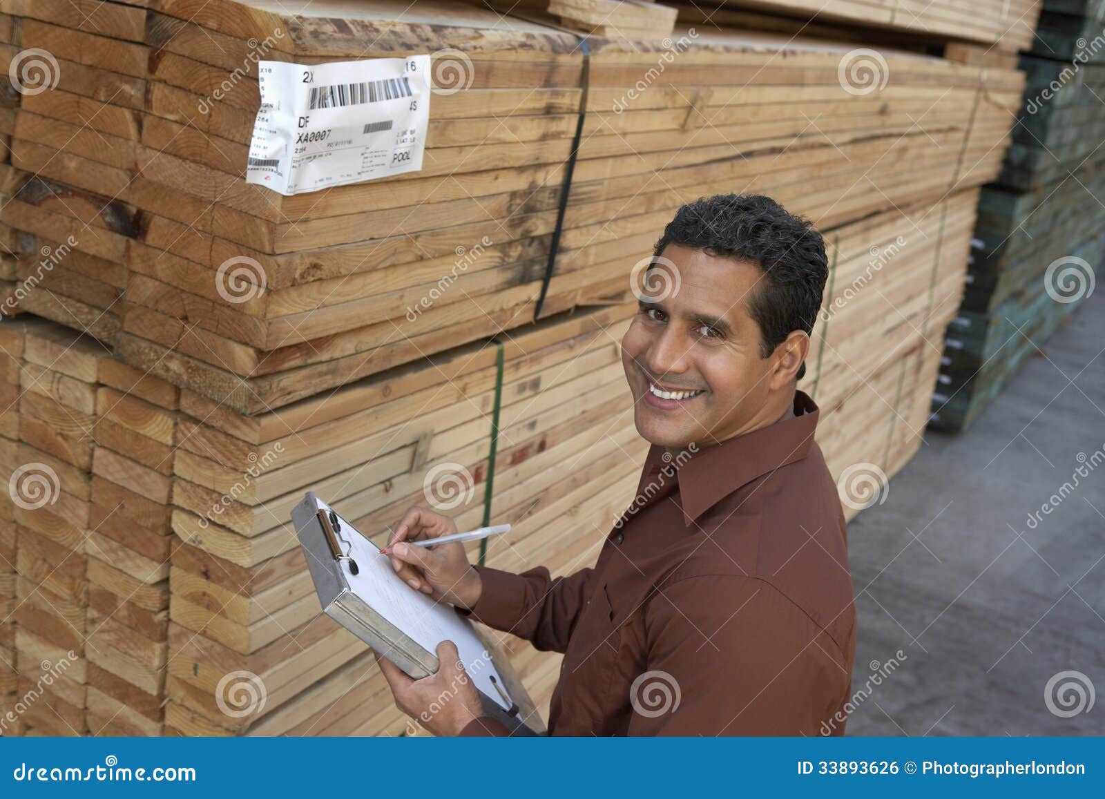 Man Checking Lumber in Warehouse Stock Photo Image of business
