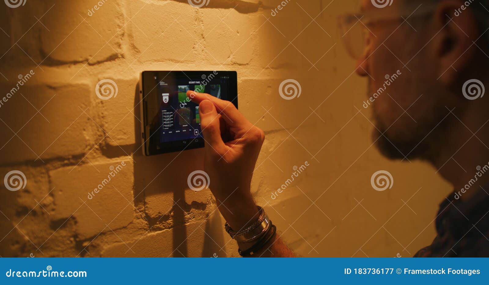 Man Checking Security Camera through Home Hub Stock Image Image of