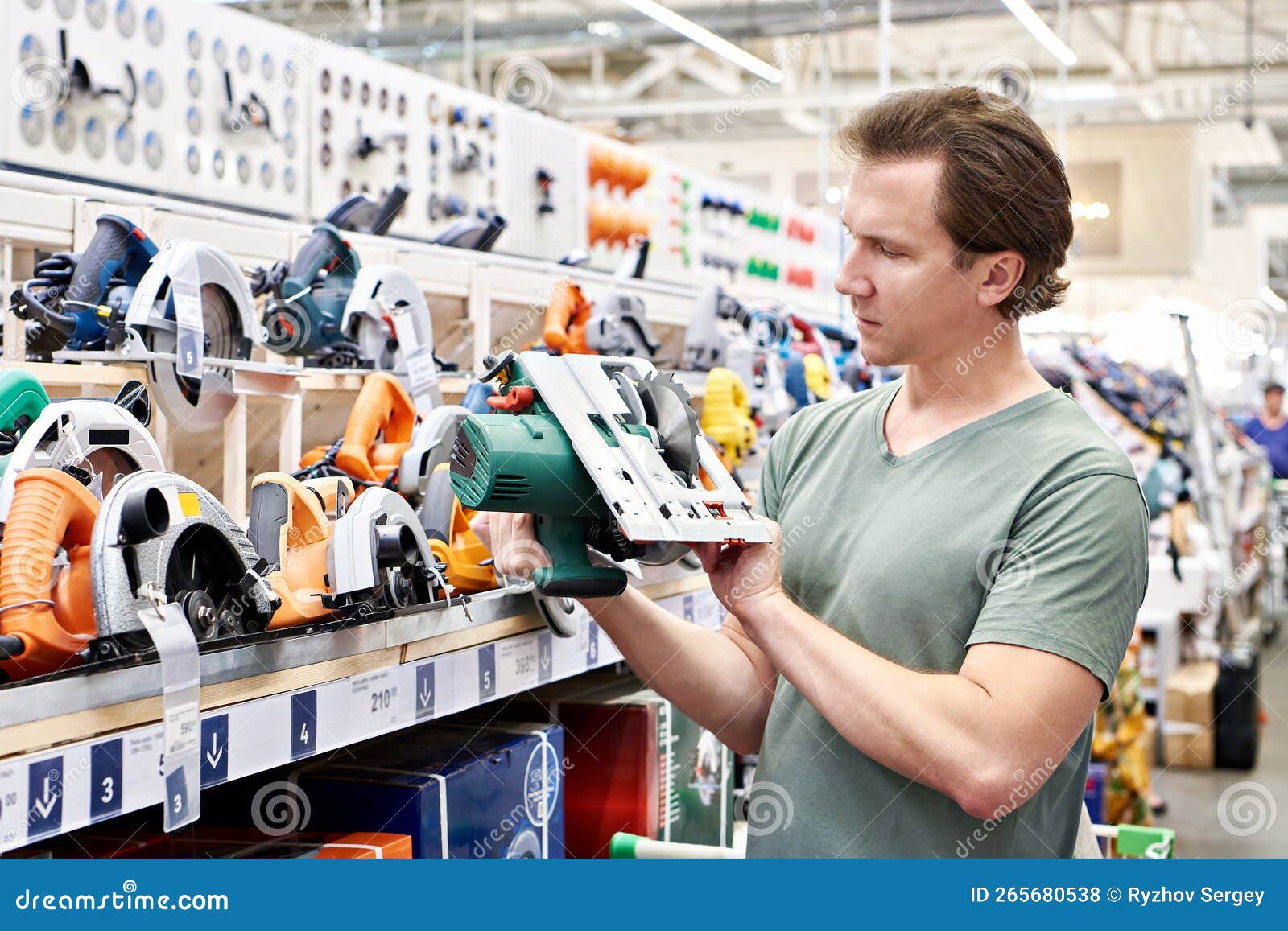 Man Chooses Electric Saws in Shop Stock Photo Image of customer