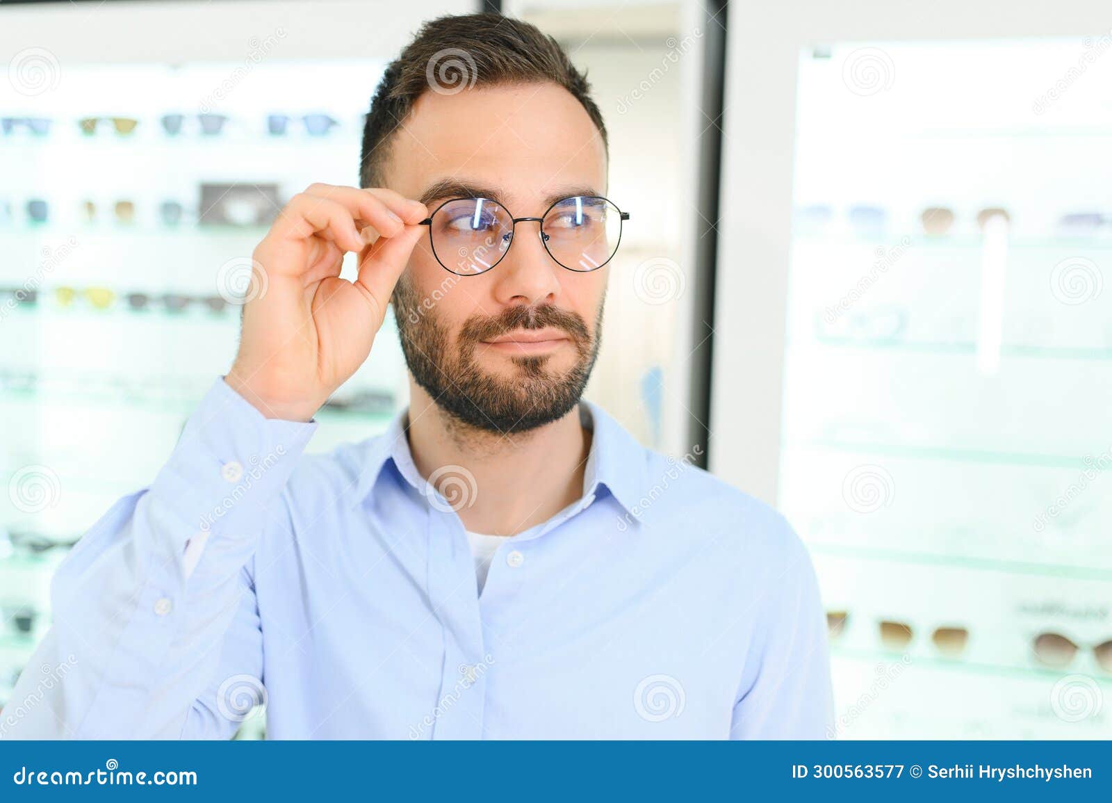 Man Choosing Glasses in Eyewear Store Stock Image Image of choosing