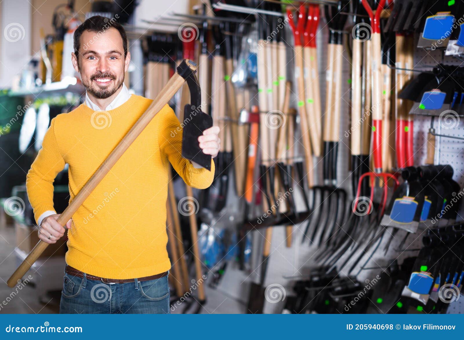 Man Choosing Various Tools in Garden Equipment Shop Stock Photo Image