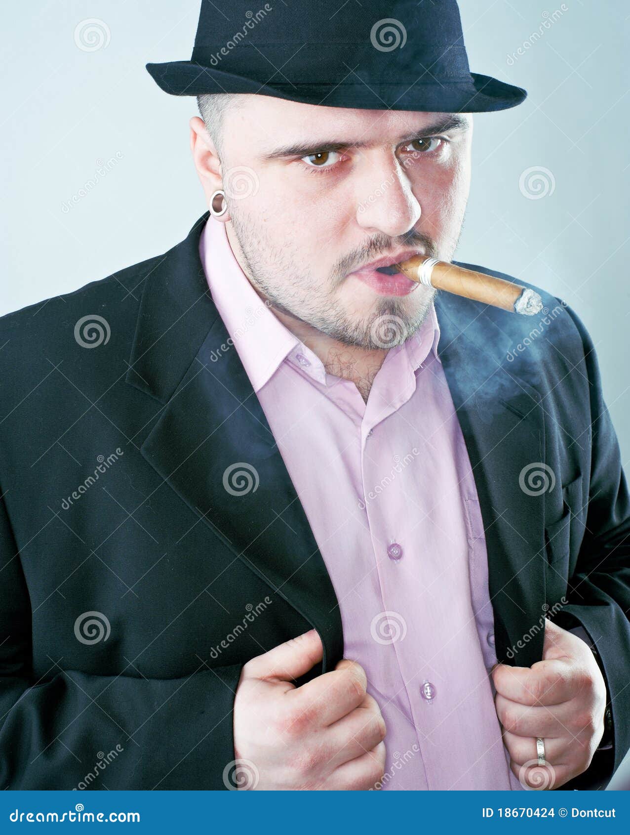 Man with cigar in hat stock photo. Image of dark, heat 18670424