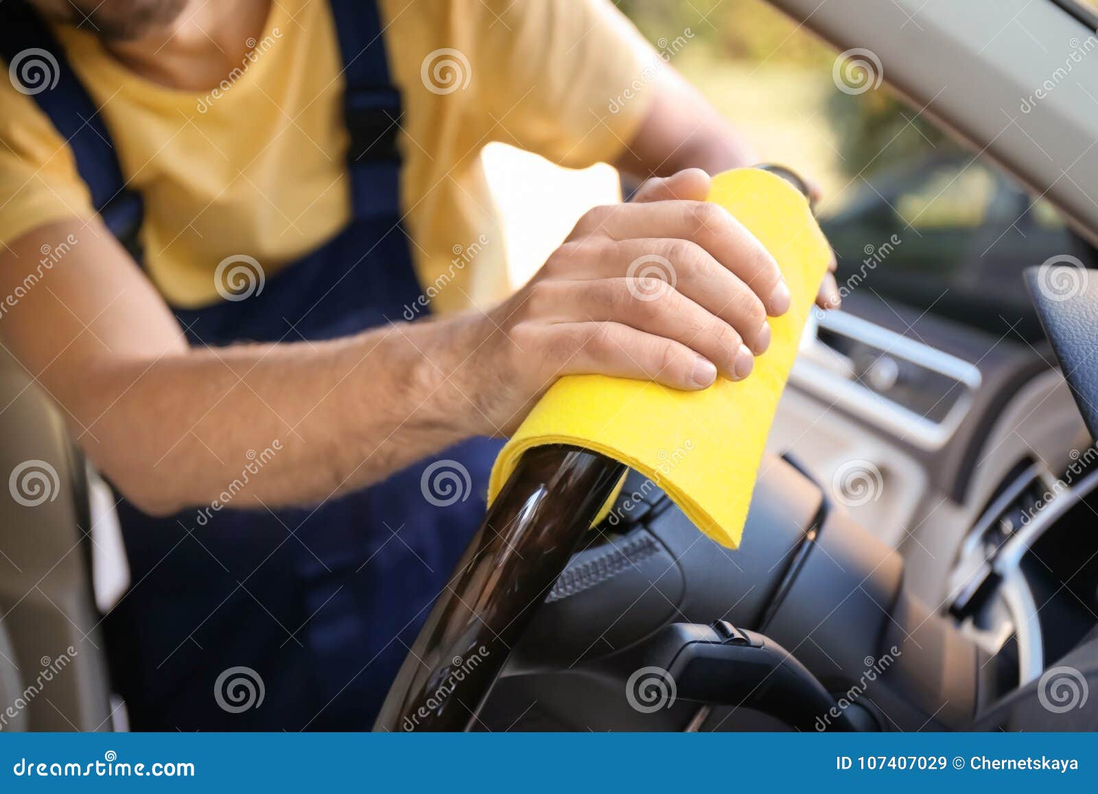 Man Cleaning Car Steering Wheel with Rag Stock Image Image of male