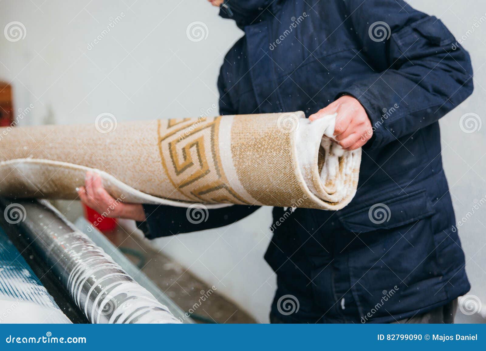 Man cleaning carpet stock photo. Image of protection 82799090