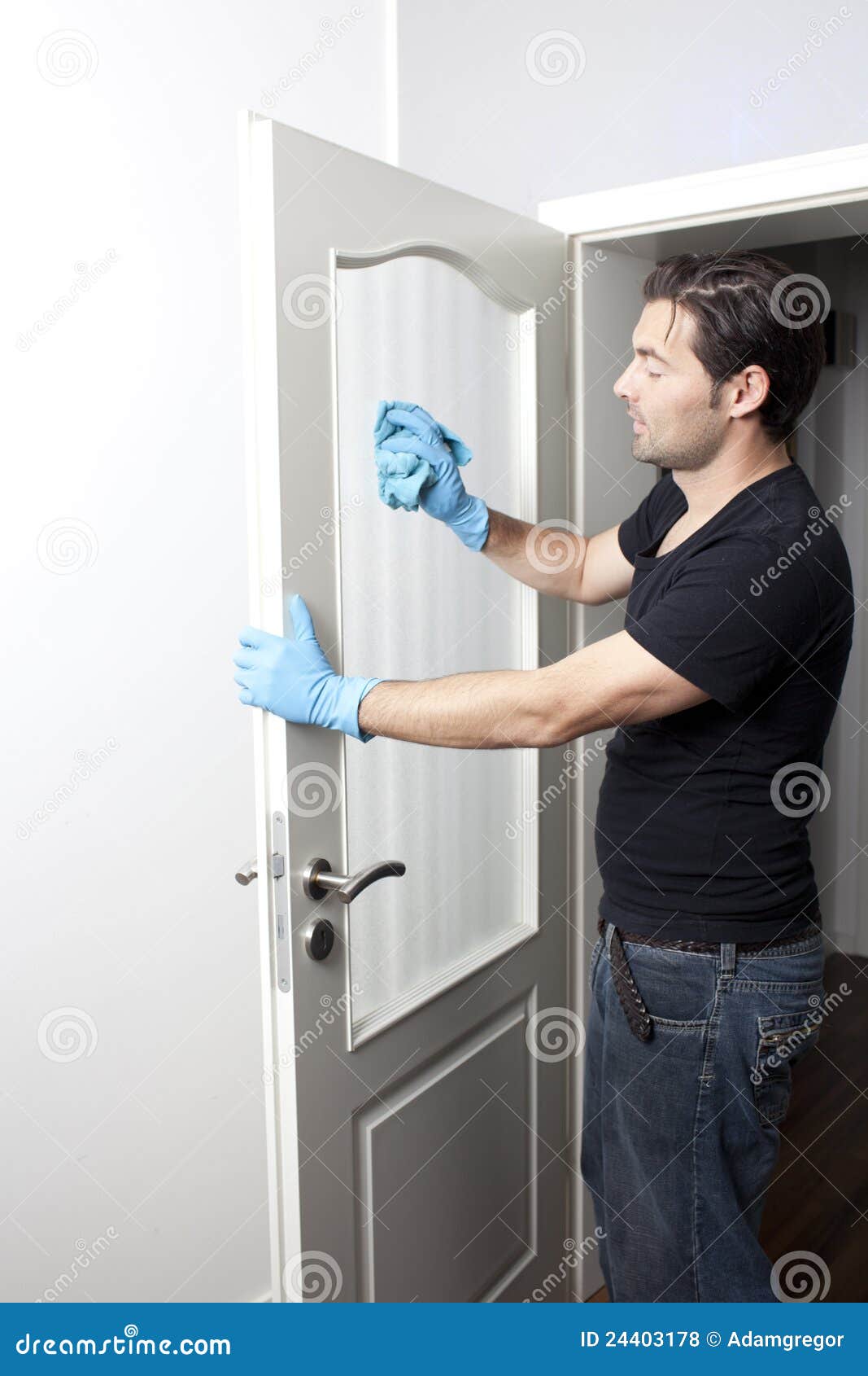 Man cleaning a door stock photo. Image of light, caucasian 24403178