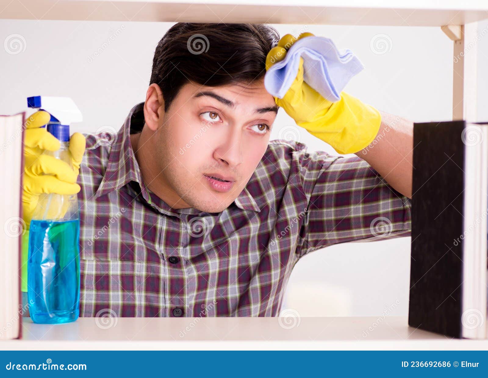 Man Cleaning Dust from Bookshelf Stock Photo Image of housekeeping