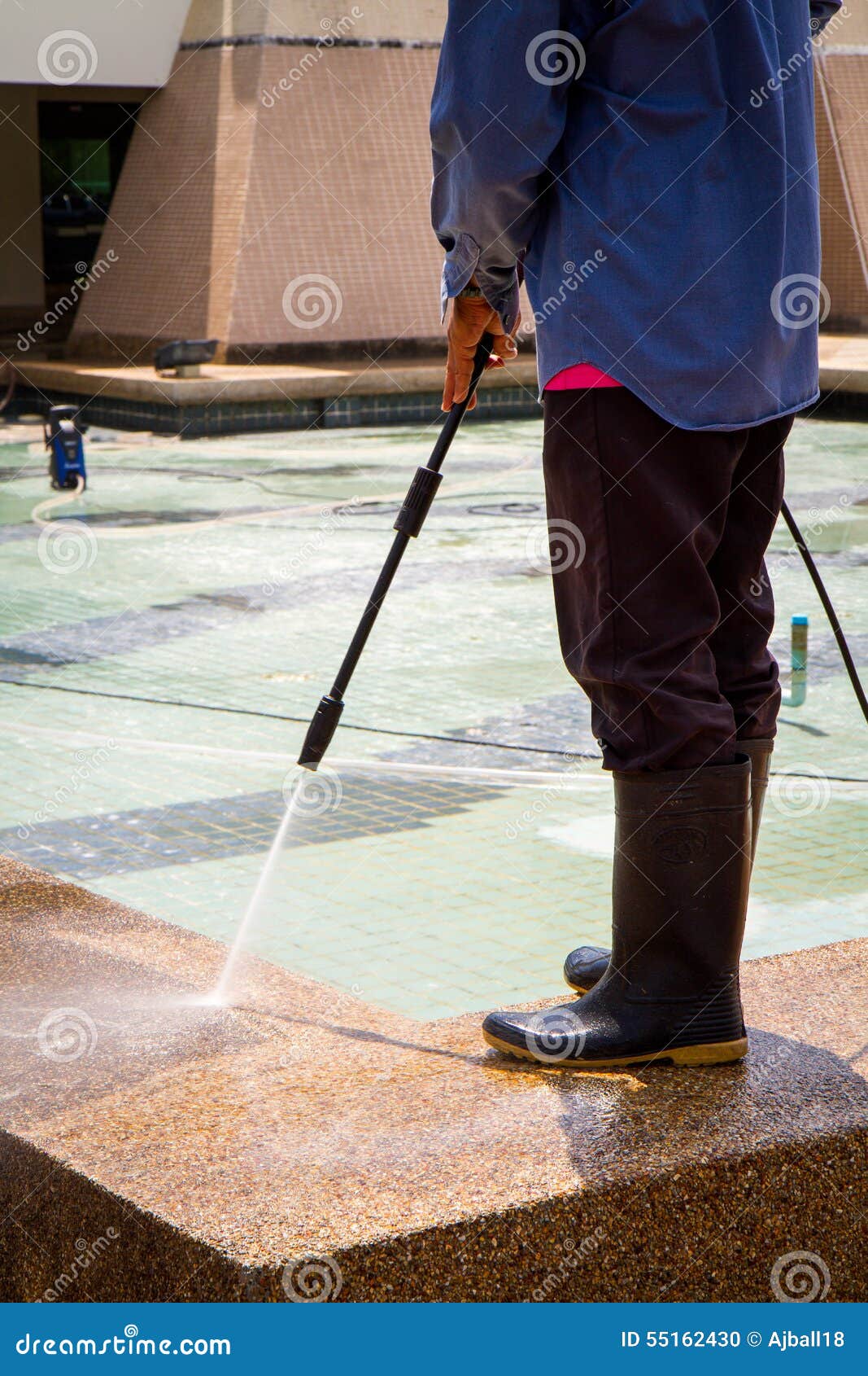 A Man Cleaning Floor with High Pressure Water Jet Stock Photo - Image ...