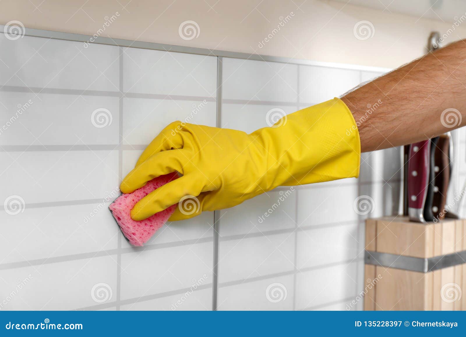 Man Cleaning Kitchen Wall Tiles With Sponge Stock Image - Image of