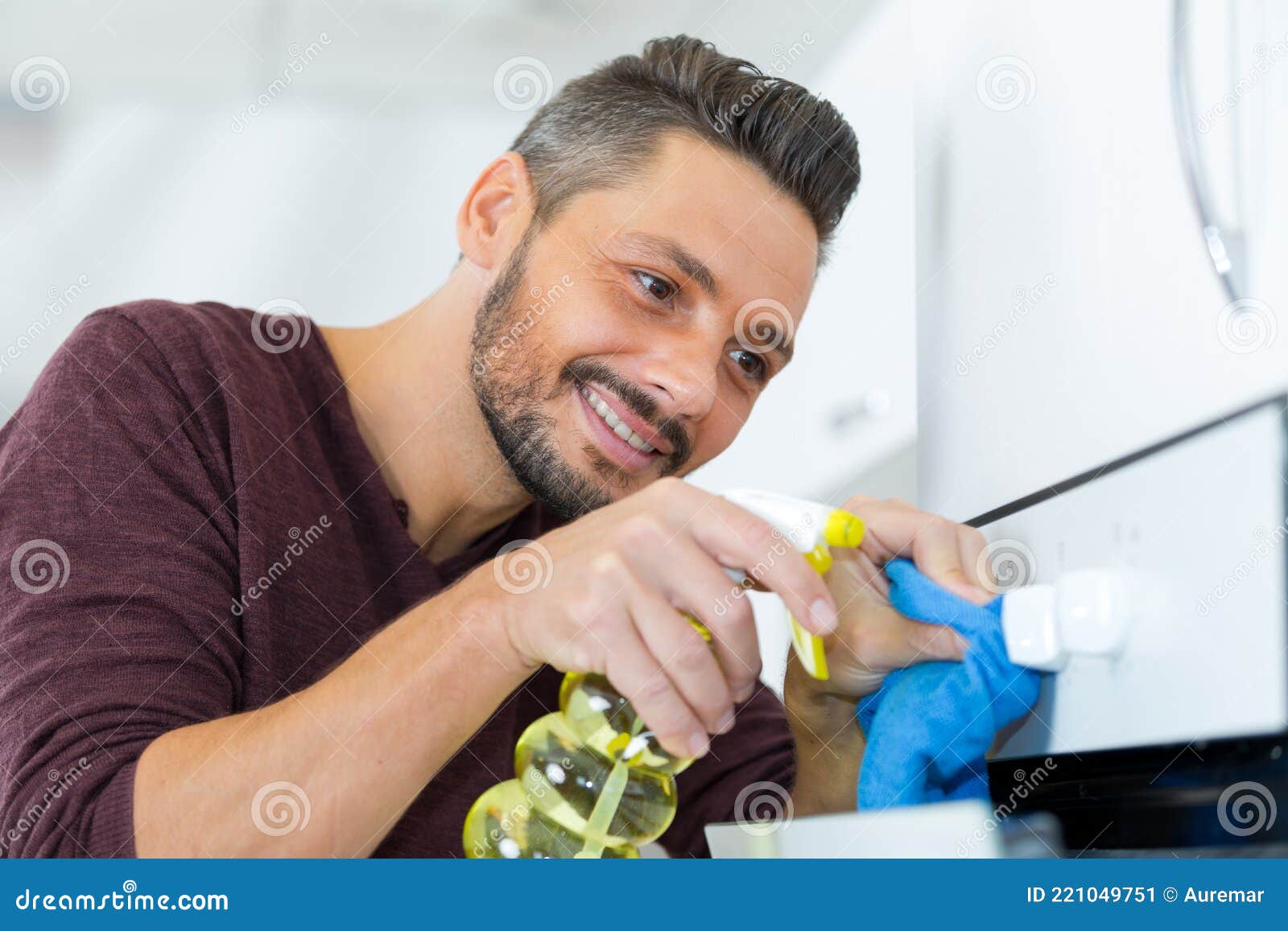 Man cleaning oven knob stock image. Image of power, holding 221049751