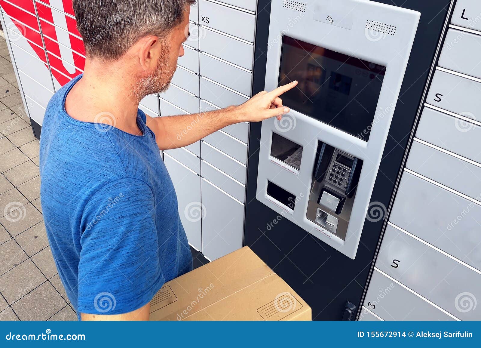 Client Using Automated Self Service Post Terminal Machine or Locker To