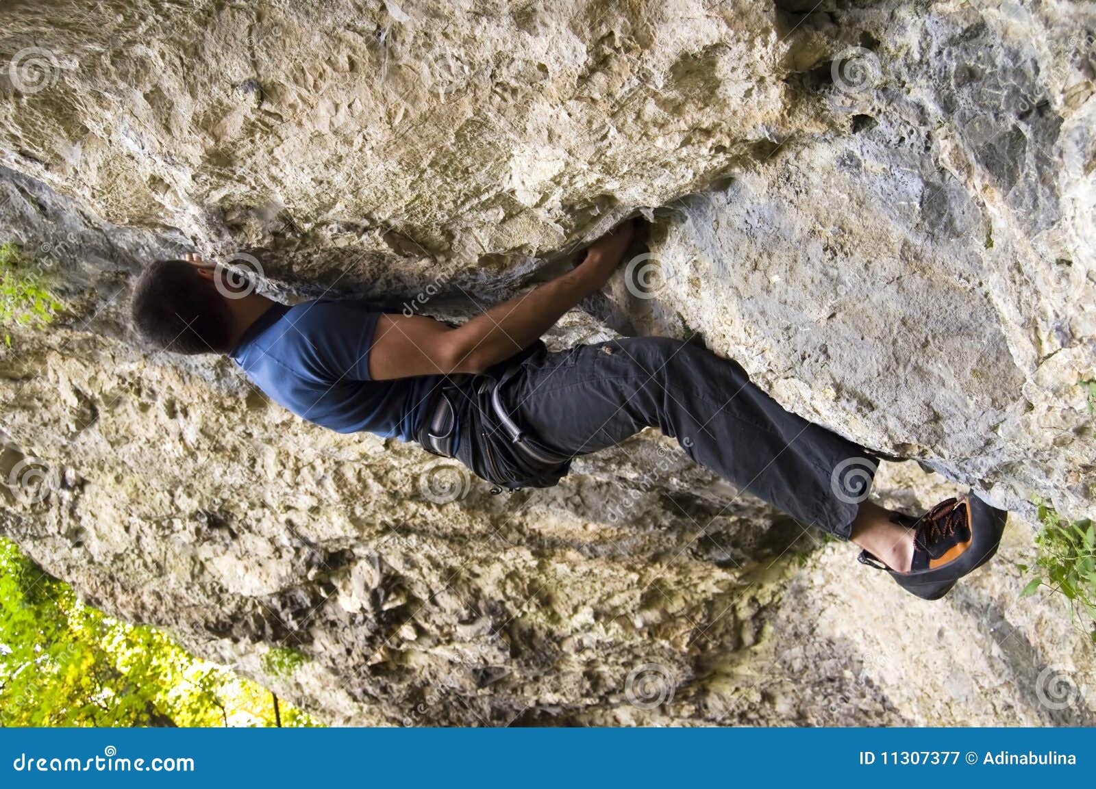Man climbing a boulder stock image. Image of climber 11307377