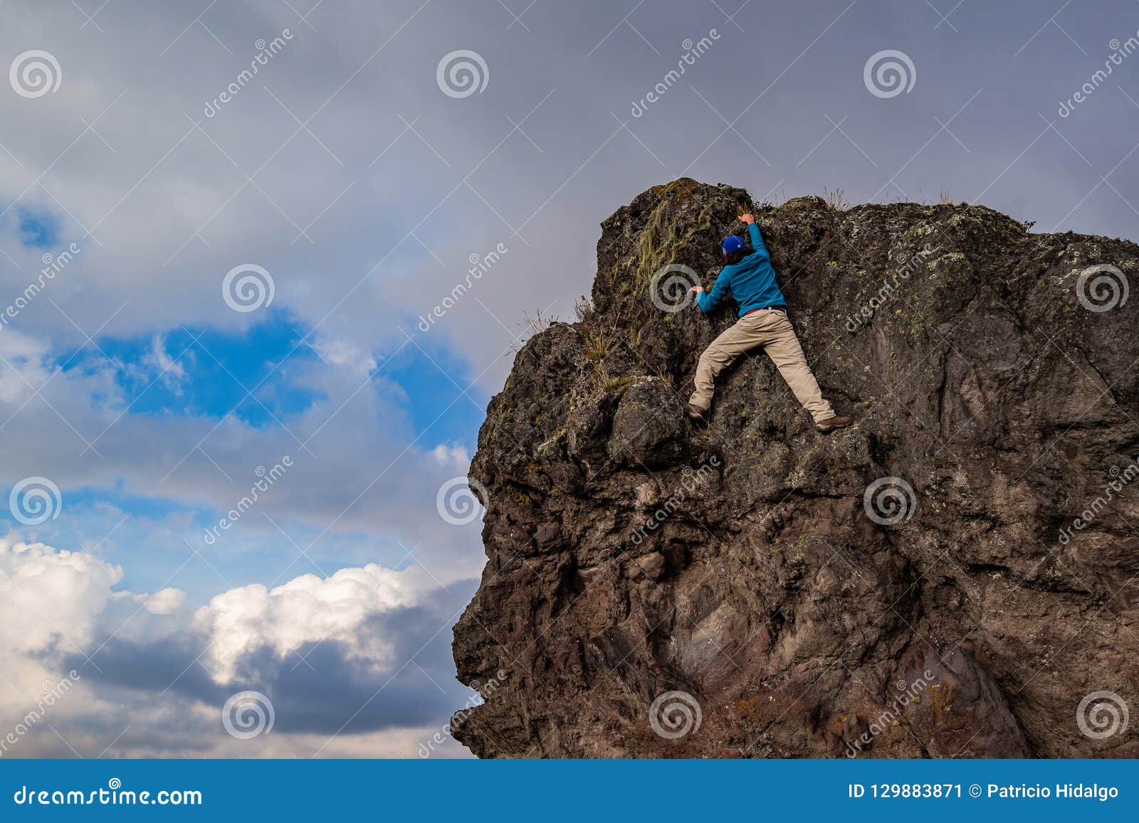 Man climbing a rock stock image. Image of high, outdoor 129883871