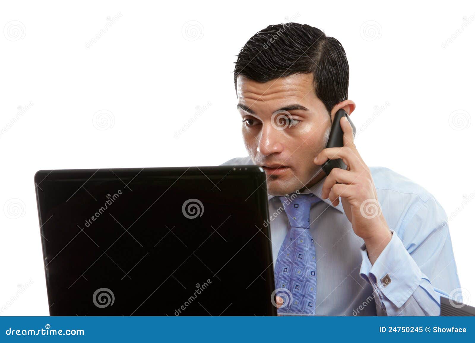 Man At Computer Making Or Receiving Phone Call Royalty Free Stock Photo