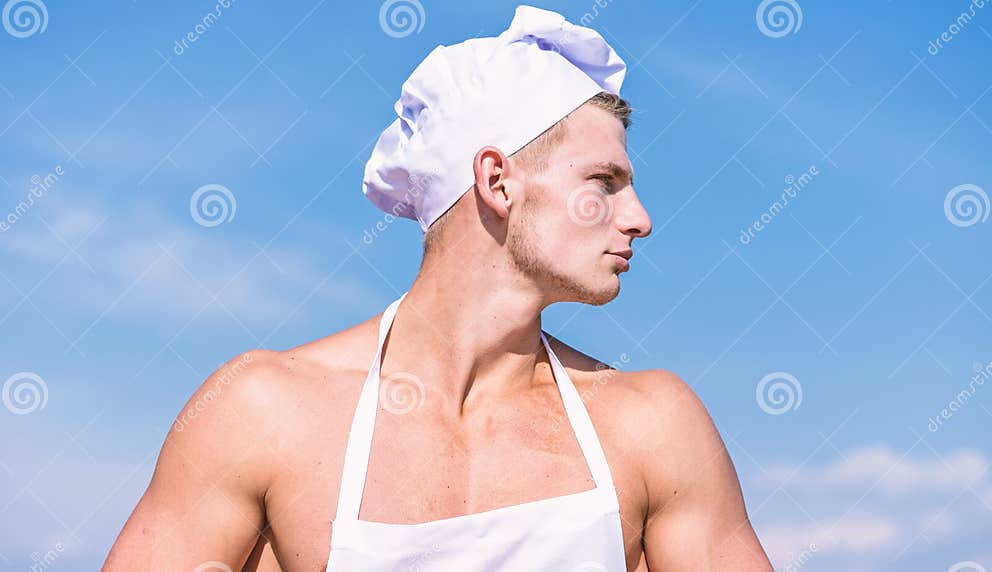 Man On Confident Face Wears Cooking Hat And Apron Sky On Background Cook Or Chef With Muscular 