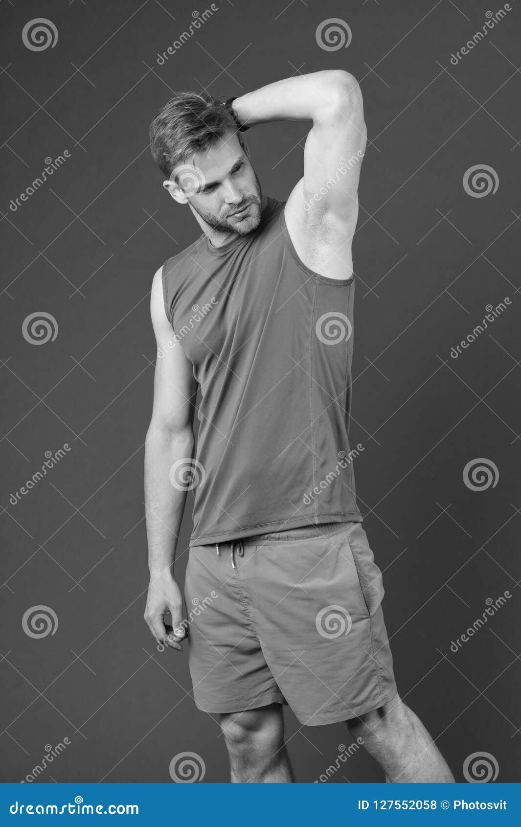 man confident in his antiperspirant. guy checks dry armpit satisfied with healthy skin. prevent, reduce perspiration. no