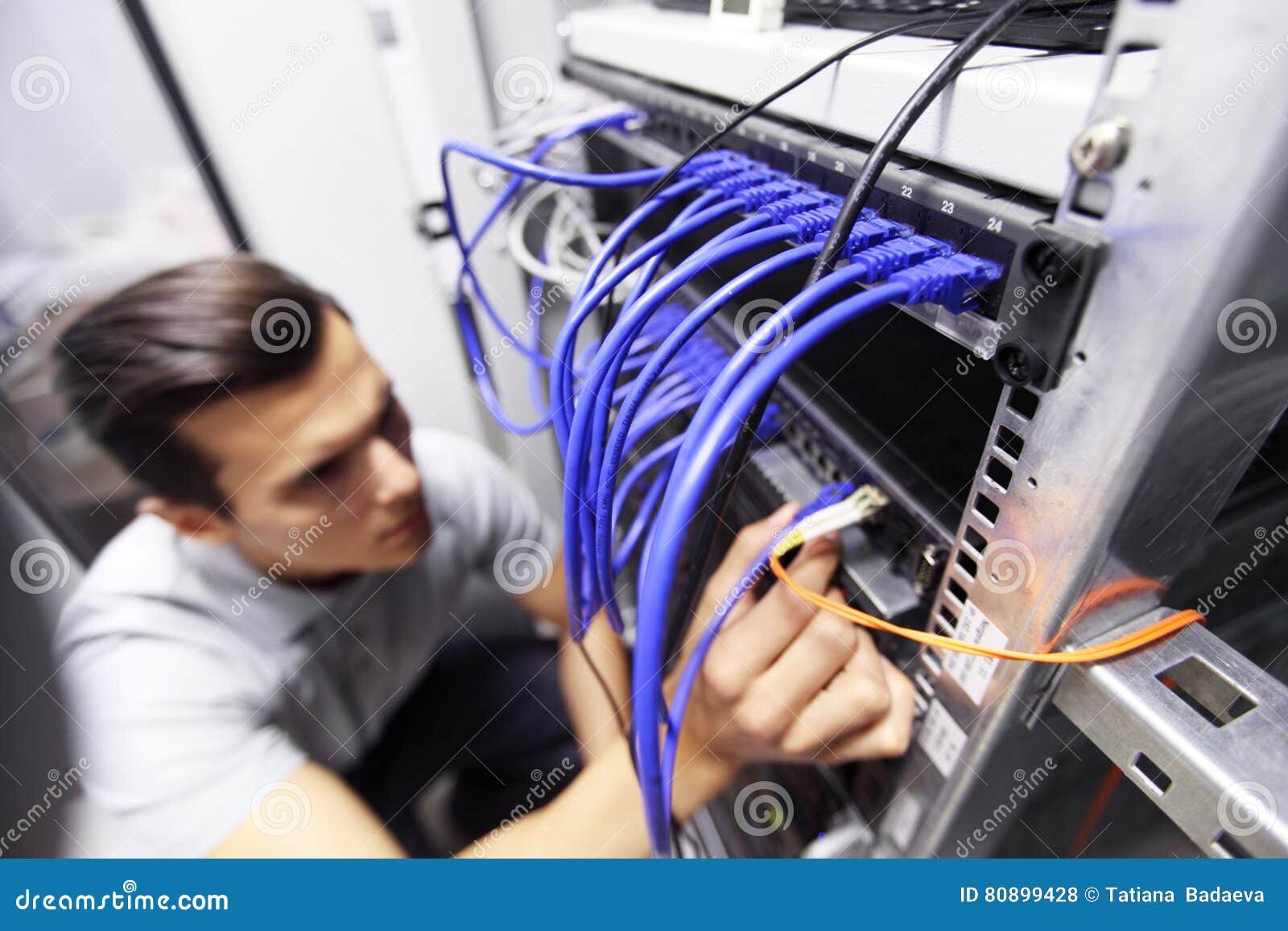 Man connecting cables stock photo. Image of 80899428