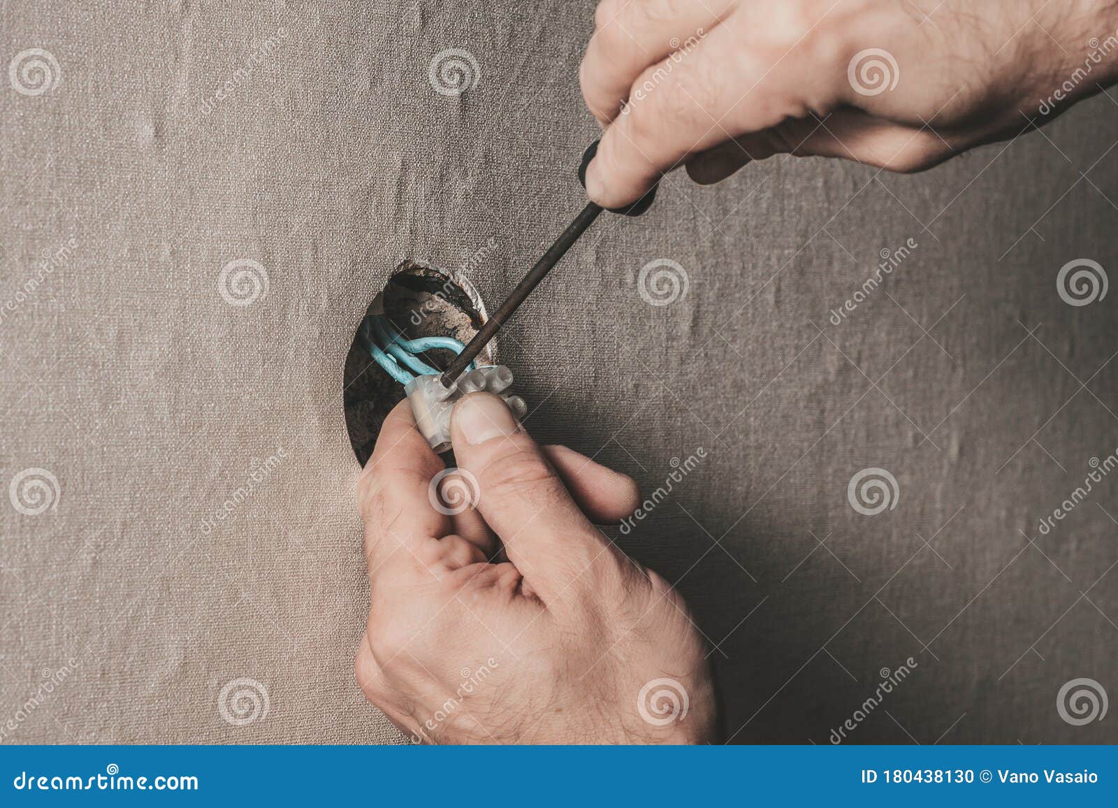 Man Connects an Electrical Light Switch To the Wall Electrical Work Stock Photo Image of