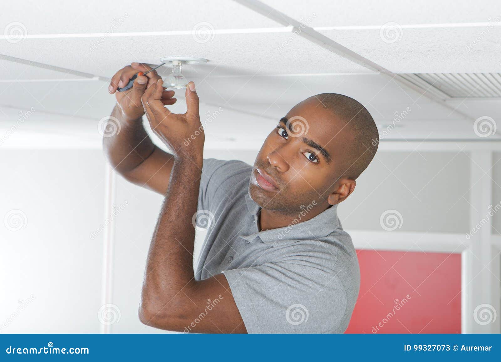 man controlling smoke detector