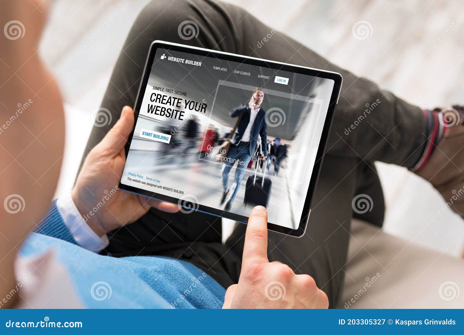 man creating website by using tablet