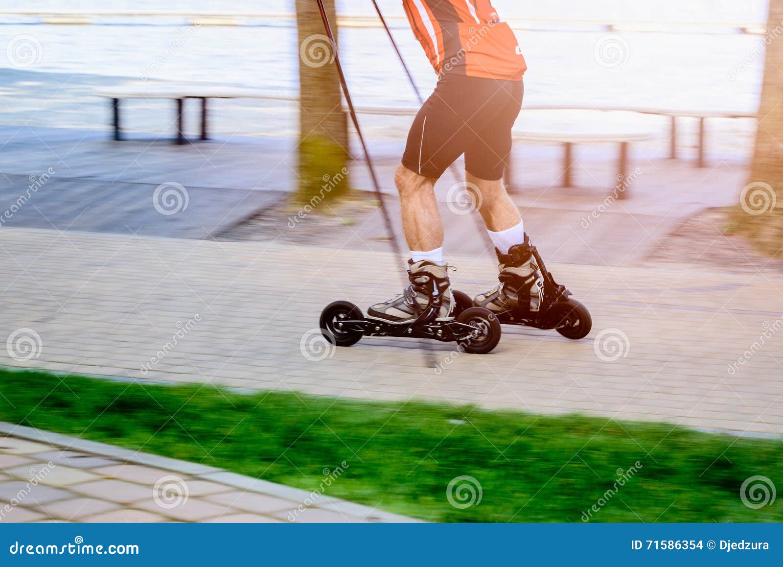 man cross country skiing with roller ski